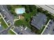 An aerial shot showing a community pool, parking, landscaping, and condo building at 207 Keats Ct # 102, Carmel, IN 46032