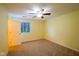 Spacious bedroom with neutral carpet, a ceiling fan, a window, and a closet at 207 Keats Ct # 102, Carmel, IN 46032