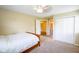 Comfortable bedroom with neutral carpeting and a view of the entryway at 207 Keats Ct # 102, Carmel, IN 46032