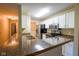 Charming kitchen with granite countertops and stainless steel appliances at 207 Keats Ct # 102, Carmel, IN 46032