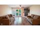 Spacious living room features hard wood floors, a fireplace, and access to a balcony at 207 Keats Ct # 102, Carmel, IN 46032