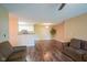Bright living room showcasing open layout and views of the kitchen at 207 Keats Ct # 102, Carmel, IN 46032
