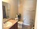 Well-lit bathroom features a vanity, toilet, and decorative shelving for an organized space at 2253 Jaybird Dr, Greenfield, IN 46140