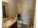 Well-lit bathroom featuring a vanity sink, a toilet, and decorative accents at 2253 Jaybird Dr, Greenfield, IN 46140