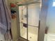 Bathroom with a glass-door shower stall and a towel rack with rolled towels at 2253 Jaybird Dr, Greenfield, IN 46140