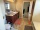 Bathroom featuring a vanity with a sink and an open doorway to another room at 2253 Jaybird Dr, Greenfield, IN 46140