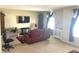 Cozy living room with comfortable seating and a wall-mounted TV for entertainment at 2253 Jaybird Dr, Greenfield, IN 46140
