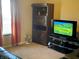 Cozy living room with a large bookcase, television, and comfortable seating area at 2253 Jaybird Dr, Greenfield, IN 46140