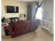 Relaxing living room featuring a comfortable recliner, a large TV, and stylish decorations at 2253 Jaybird Dr, Greenfield, IN 46140