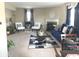 Cozy living room featuring a fireplace, plush blue sofa, stylish rug, and an abundance of natural light at 2253 Jaybird Dr, Greenfield, IN 46140