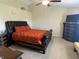 Spacious main bedroom featuring a large bed, a ceiling fan, and a dresser at 2253 Jaybird Dr, Greenfield, IN 46140