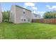 Lush backyard with a privacy fence, creating a serene outdoor space for relaxation and activities at 2270 Collins Way, Greenfield, IN 46140