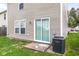 Backyard view shows sliding glass door and gray vinyl siding at 2270 Collins Way, Greenfield, IN 46140