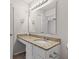 Bathroom featuring a granite vanity top, large mirror, and a combination towel holder and grab bar at 2270 Collins Way, Greenfield, IN 46140