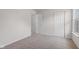 Bedroom with neutral carpet flooring, a window, and a closet for easy storage at 2270 Collins Way, Greenfield, IN 46140