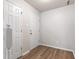 Bright foyer with laminate flooring, closet, and white trim at 2270 Collins Way, Greenfield, IN 46140