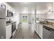 The kitchen boasts granite countertops and stainless steel appliances, creating a modern and stylish space at 2270 Collins Way, Greenfield, IN 46140