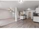 Open-concept kitchen flows into a bright living room, perfect for entertaining guests and everyday living at 2270 Collins Way, Greenfield, IN 46140