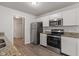 Kitchen features granite countertops, stainless steel appliances, and modern fixtures at 2270 Collins Way, Greenfield, IN 46140