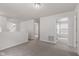 Neutral carpeted landing area with white walls, hallway entrance, and air vent, connecting different living spaces at 2270 Collins Way, Greenfield, IN 46140
