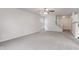 Open-concept living room with carpet flooring and access to staircase at 2270 Collins Way, Greenfield, IN 46140