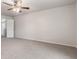 Spacious main bedroom featuring neutral carpet, ceiling fan, and access to the upper level of the home at 2270 Collins Way, Greenfield, IN 46140
