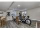 This area includes an elliptical, seating, and hardwood floors at 2553 Forest Hills Blvd, Greenwood, IN 46143