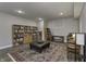 The basement living space includes bookcases and a large rug at 2553 Forest Hills Blvd, Greenwood, IN 46143