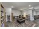 This finished basement area includes hard wood floors and a leather ottoman at 2553 Forest Hills Blvd, Greenwood, IN 46143