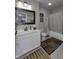 This bathroom contains a shower and a vanity with a large mirror at 2553 Forest Hills Blvd, Greenwood, IN 46143