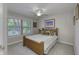 Bright bedroom with a ceiling fan, a large window and a wooden bed frame at 2553 Forest Hills Blvd, Greenwood, IN 46143