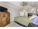 Bedroom showcasing a bed, storage cabinet, dresser, and neutral carpeting at 2553 Forest Hills Blvd, Greenwood, IN 46143