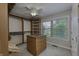 Walk-in closet with custom shelving, storage island, and plenty of hanging space at 2553 Forest Hills Blvd, Greenwood, IN 46143