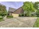 Spacious driveway leading to a large home with a two car garage and mature trees at 2553 Forest Hills Blvd, Greenwood, IN 46143