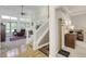 Spacious foyer with hardwood floors, staircase, and light filled living room at 2553 Forest Hills Blvd, Greenwood, IN 46143