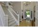 Elegant foyer with hardwood floors, staircase, and view of the front door at 2553 Forest Hills Blvd, Greenwood, IN 46143