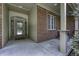 Covered front porch featuring brick accents, decorative windows, and a beautiful front door at 2553 Forest Hills Blvd, Greenwood, IN 46143