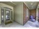 Relaxing covered front porch with brick accents and decorative front door at 2553 Forest Hills Blvd, Greenwood, IN 46143