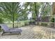 Backyard wooden deck overlooking landscaped yard, with lounge chair and seating at 2553 Forest Hills Blvd, Greenwood, IN 46143