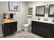 Contemporary bathroom offers a unique black and white aesthetic with a modern vanity and fixtures at 260 S 250 W, Greenfield, IN 46140