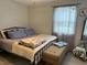 Simple bedroom with neutral colors and a comfortable bed with plenty of natural light at 260 S 250 W, Greenfield, IN 46140
