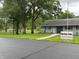 Exterior shot of the Spring Lake Community Building surrounded by lush greenery at 260 S 250 W, Greenfield, IN 46140