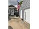 View of the home's exterior with garage, door, and an American flag at 260 S 250 W, Greenfield, IN 46140