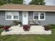 Charming front porch featuring colorful flowers and a cozy seating area at 260 S 250 W, Greenfield, IN 46140