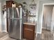 Kitchen with stainless steel refrigerator and charming farmhouse-style decorations at 260 S 250 W, Greenfield, IN 46140