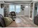 Inviting living room features hardwood floors, a rustic wood accent wall, and natural light at 260 S 250 W, Greenfield, IN 46140