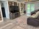 Comfortable living space offers rustic wood accents, backyard access, and a stylish entertainment center at 260 S 250 W, Greenfield, IN 46140