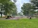 The community playground features slides and swings for neighborhood children to enjoy at 260 S 250 W, Greenfield, IN 46140