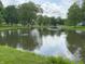 A tranquil pond reflects the beauty of the homes and surrounding landscape at 260 S 250 W, Greenfield, IN 46140