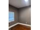 Bedroom featuring bare walls, hardwood floors and a window at 319 S Temple Ave, Indianapolis, IN 46201